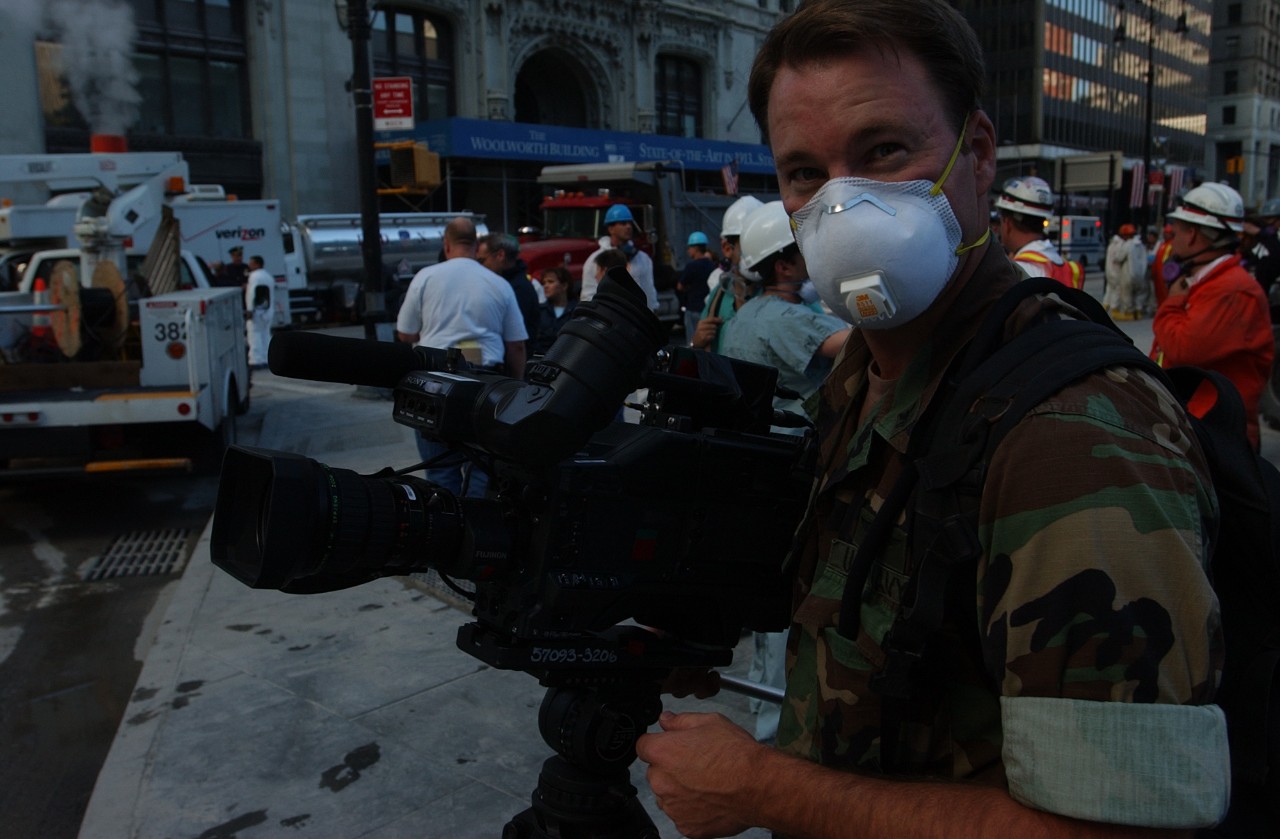 A Navy combat photographer documents the scene at Ground Zero in New York City following the attacks on 9/11, 15 September 2001