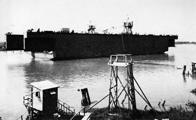 Launching the Center Section of YFD-6. This 18,000-ton steel floating drydock was launched at Morgan City, La., October 1943.