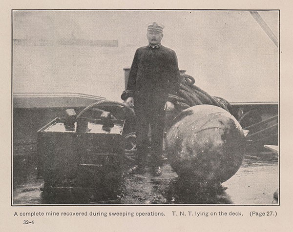 A complete mine recovered during sweeping operations. T. N. T. lying on the deck. (Page 27.)