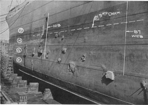 Photo 1: USS ELECTRA - port side looking forward and showing the small patches over fragment holes.
