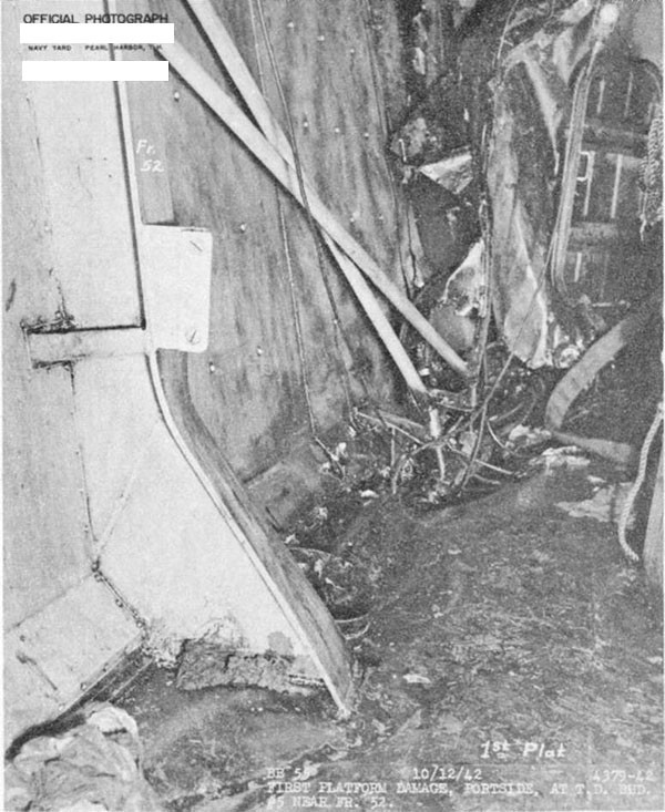 Photo 28. Damage in A-422M, looking forward.