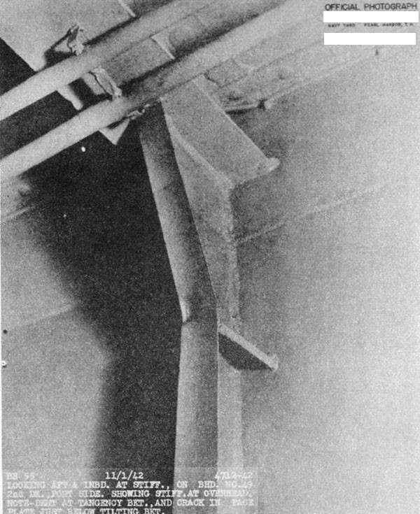 Photo 36. Stiffener on bulkhead 49, second deck, port. Dent in flange near tangency bracket and crack in flange.