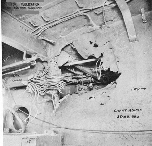 Photo 20: Hit No. 12 (5-1/2") looking inboard at the starboard bulkhead of the chart house and showing damage to the circulating water cooler for the starboard 1.1 mount.
