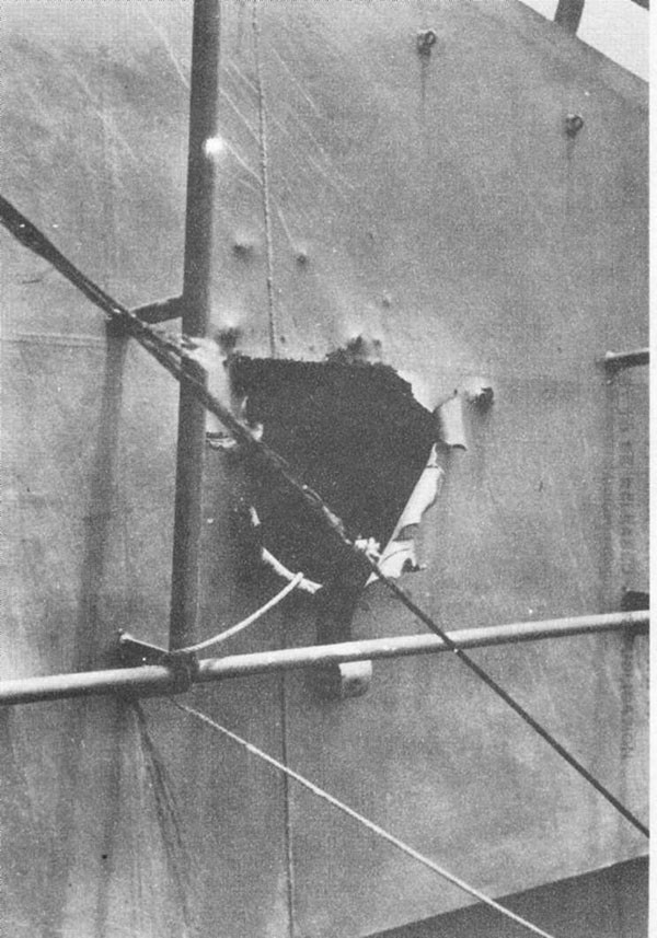 Photo 32: Hit No. 23. Damage to port side of stack hood.