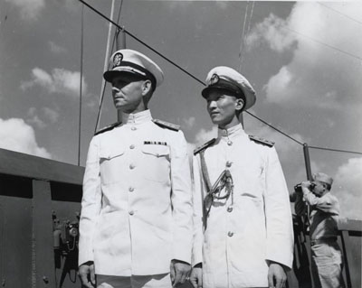 Rear Admiral Milton E. Miles, USN on board USS Rocy Mount (AGC-3), in Chinese waters, circa September-October 1945. He is with an officer of the Chinese Navy.