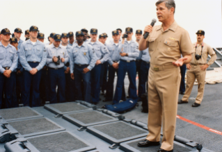 Informal full-length portrait of the CHIEF of Naval Operations, Admiral  Jeremy M. Boorda, USN, in dress white formal uniform. Photograph was taken  on the first floor of his official residence. (Exact date