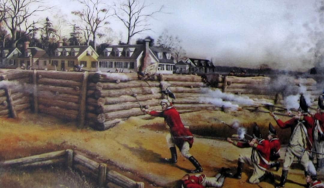 men in red coats advance on breastworks