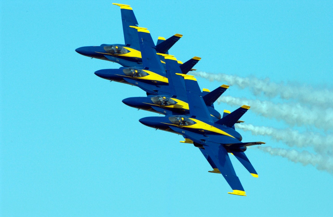 031108-N-5862D-202:  Blue Angels Maneuver:  Diamond Echelon Parade.  F/A-18 Hornet Aircraft, November 2003.  The Navy’s Blue Angels flight demonstration team maintains a tight formation thrilling the audience, estimated at 100,000 spectators, at Sherman Field onboard Naval Air Station (NAS) Pensacola, Florida, November 8, 2003.   The homecoming air show signifies the final performance of the season for the team that is based here.  Photographed by Chief Photographer’s Mate Chris Desmond. Official Navy Photograph.  