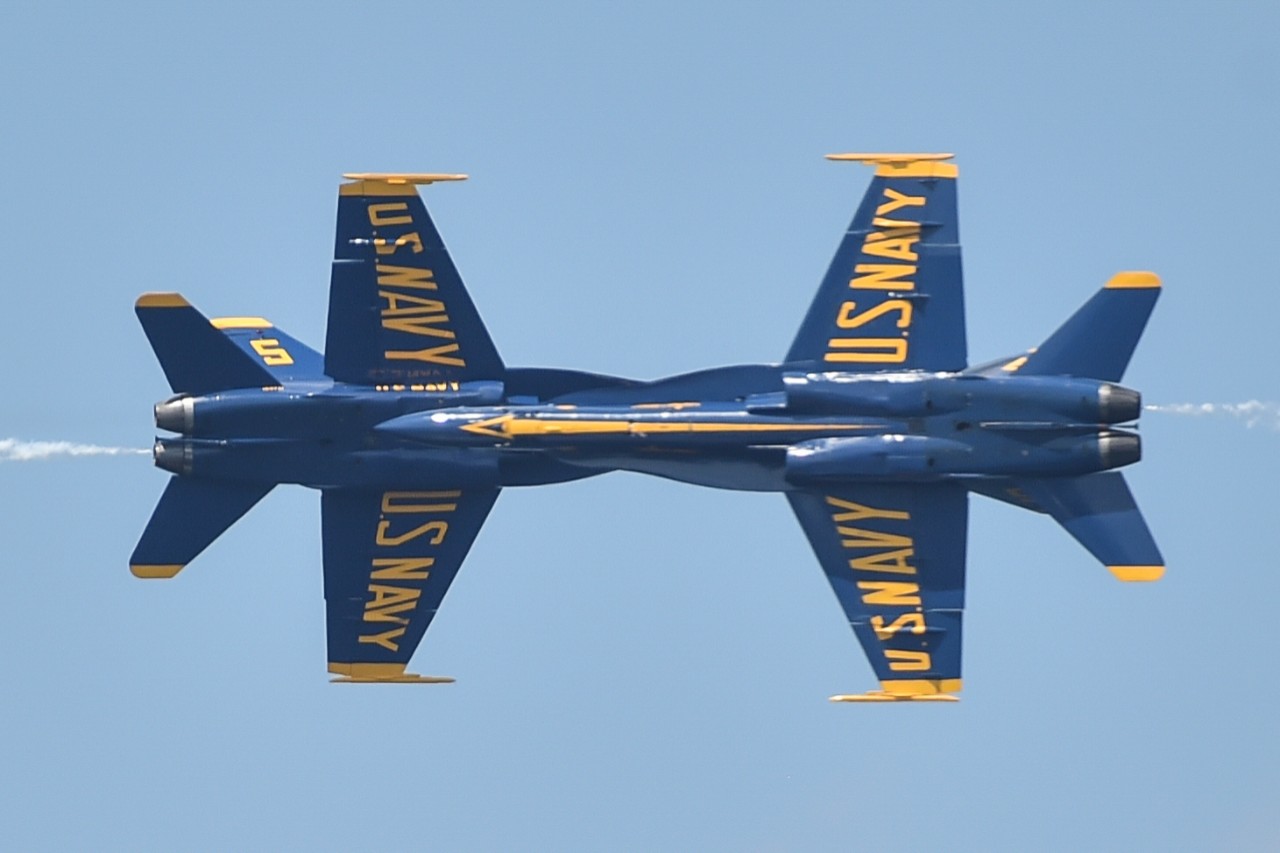 180701-N-UK306-1143:   Blue Angels Maneuver:  Opposing Minimum Radius Turn Maneuver.  F/A-18 Aircraft, July 2018.    Solo pilots assigned to the U.S. Navy flight demonstration squadron, the Blue Angels, perform the Opposing Minimum Radius Turn maneuver during the National Cherry Festival in Traverse City, Michigan, July 1, 2018. The Blue Angels are scheduled to perform more than 60 demonstrations at more than 30 locations across the U.S. and Canada in 2018.  Photographed by Mass Communication Specialist 2nd Class Timothy Schumaker.  Official U.S. Navy Photograph.