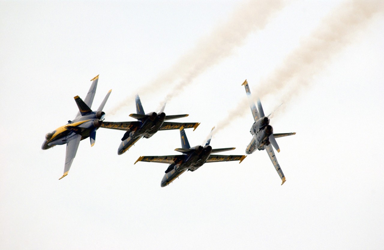 330-CFD-DF-SD-04-07053:  Blue Angels Maneuver:   Diamond Low Break Cross.  F/A-18C Hornets, May 2002.   Demonstration team perform the Diamond Low Break Cross during the Joint Services Open House Ceremony, held at Andrews Air Force (AFB), Maryland, May 18, 2002.  Photographed by SRA Joseph R. Lozada, USAF.   Official Department of Defense Photograph, now in the collections of the National Archives.  