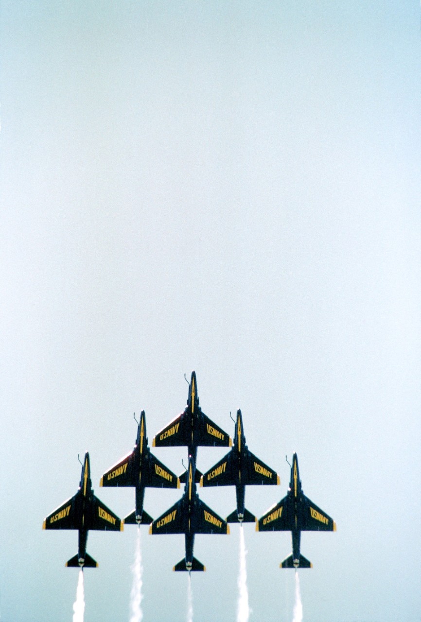 330-CFD-DN-SC-85-00447:   Blue Angels Maneuver:  Delta Formation.   Six A-4F Skyhawk II aircraft in a delta formation during an air show, August 20, 1984.   Department of Defense Photograph, now in the collections of the National Archives.  