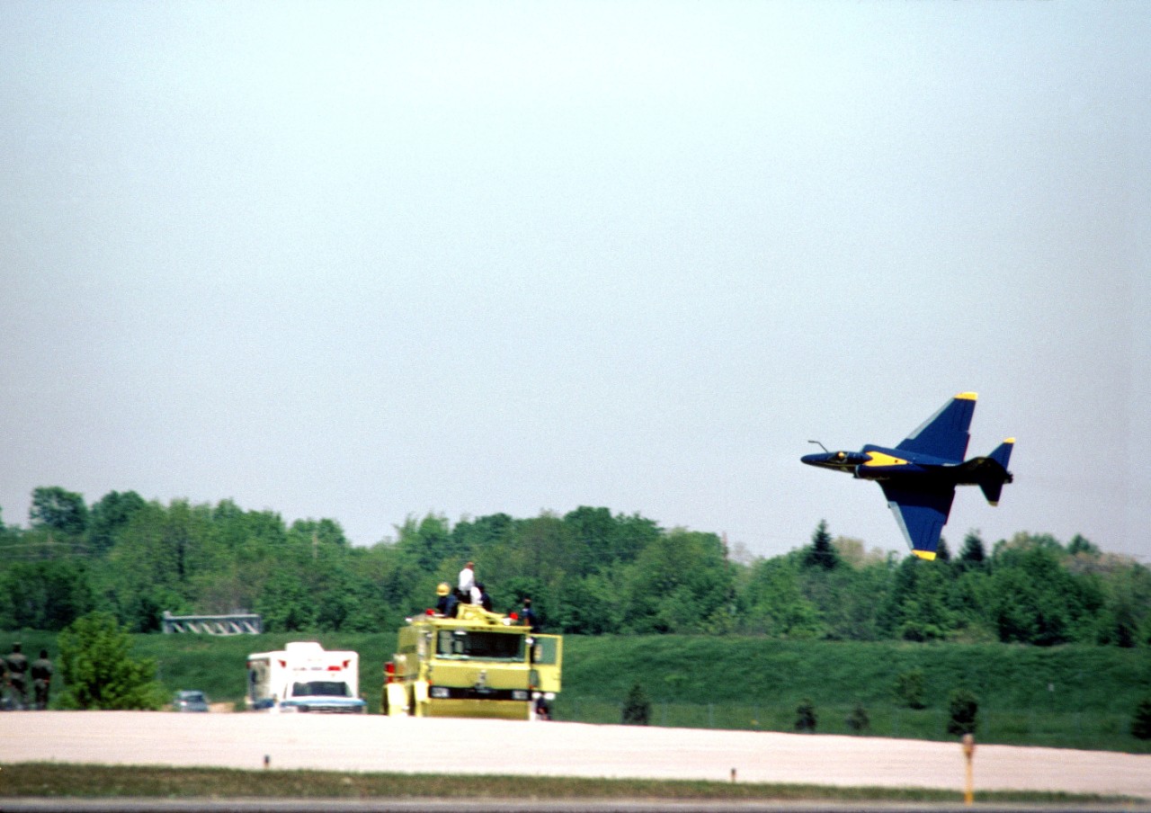 330-CFD-DN-SC-85-00473:   Blue Angels Maneuver:   Low-Level Roll Over the Flight Line.  A-4F Skyhawk, August 1984.   The A-4F Skyhawk executes a low-level roll over the flight line during an air show.   Official U.S. Navy Photograph, now in the collections of the National Archives. 
