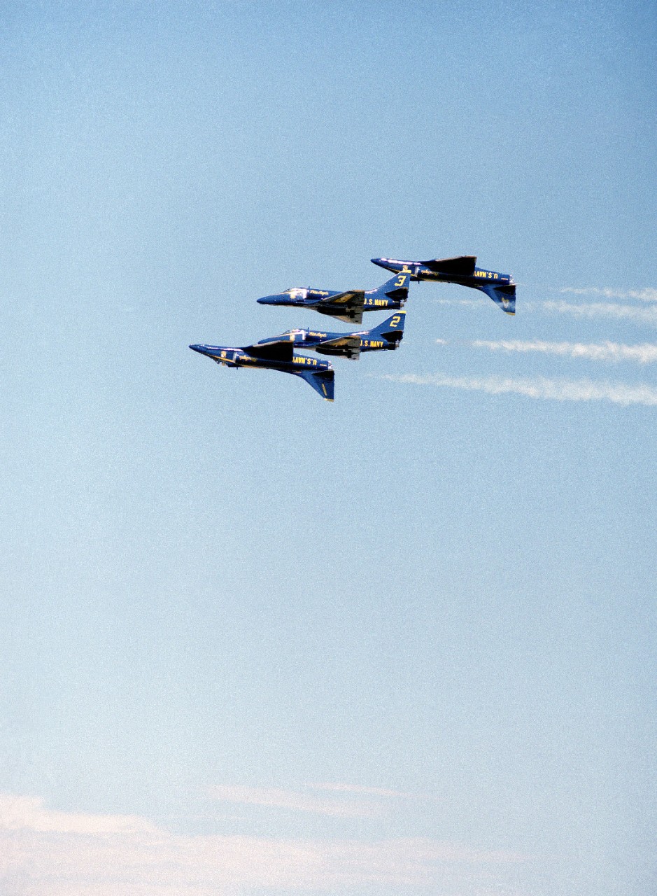 330-CFD-DN-SC-90-01432:  Blue Angels Maneuver:  Double Farvel.  A-4F Skyhawk aircraft.   An air show at  Naval Air Station, Moffett Field, California.  Photographed by PH3 Xanos.  Official U.S. Navy Photograph, now in the collections of the National Archives. 