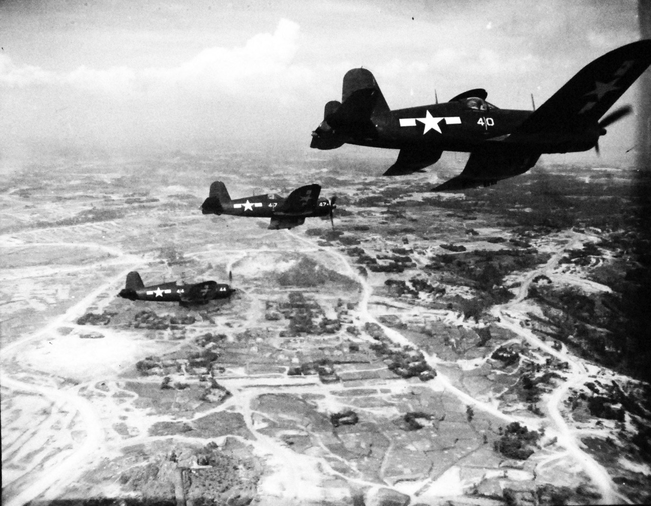 127-GW-524-128521:  Vought F4u Corsair, circa 1945.  F4U “Corsairs” of the “Death Rattlers” Fighter Squadron, VMF-323, in various formations on a rocket strike against Japanese positions south of the front lines on Okinawa.  The “Rattlers” were commanded by Major George A. Axtell, Jr, circa 1945.  Official U.S. Marine Corps photograph, now in the collections of the National Archives. 
