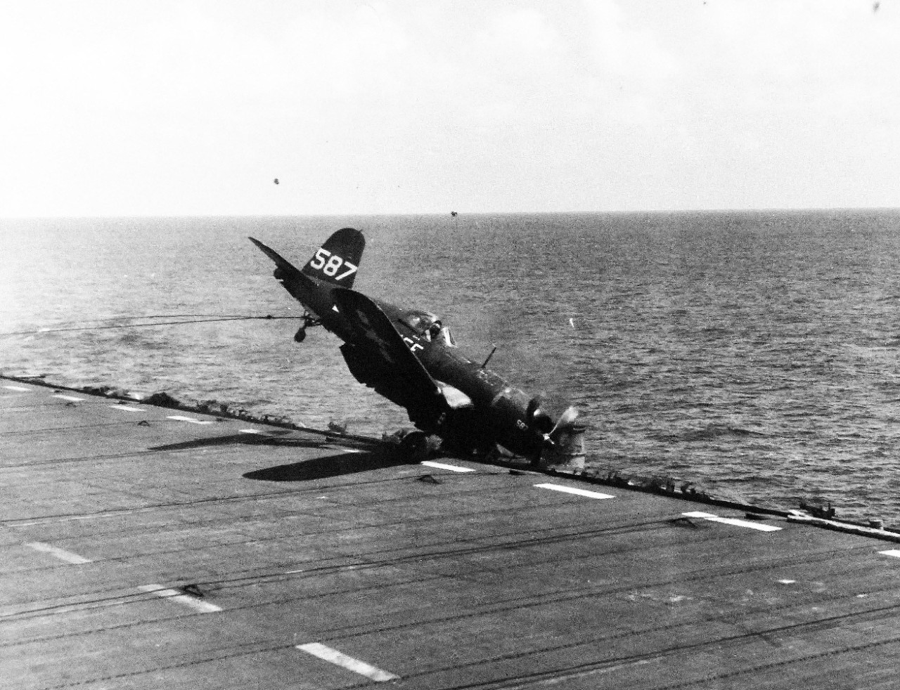 80-G-383978:  Vought F4U Corsair, April 1945.  Crash of a F4U into catwalk onboard USS Guadalcanal (CVE-60), April 5, 1945.   Official U.S. Navy photograph, now in the collections of the National Archives.  