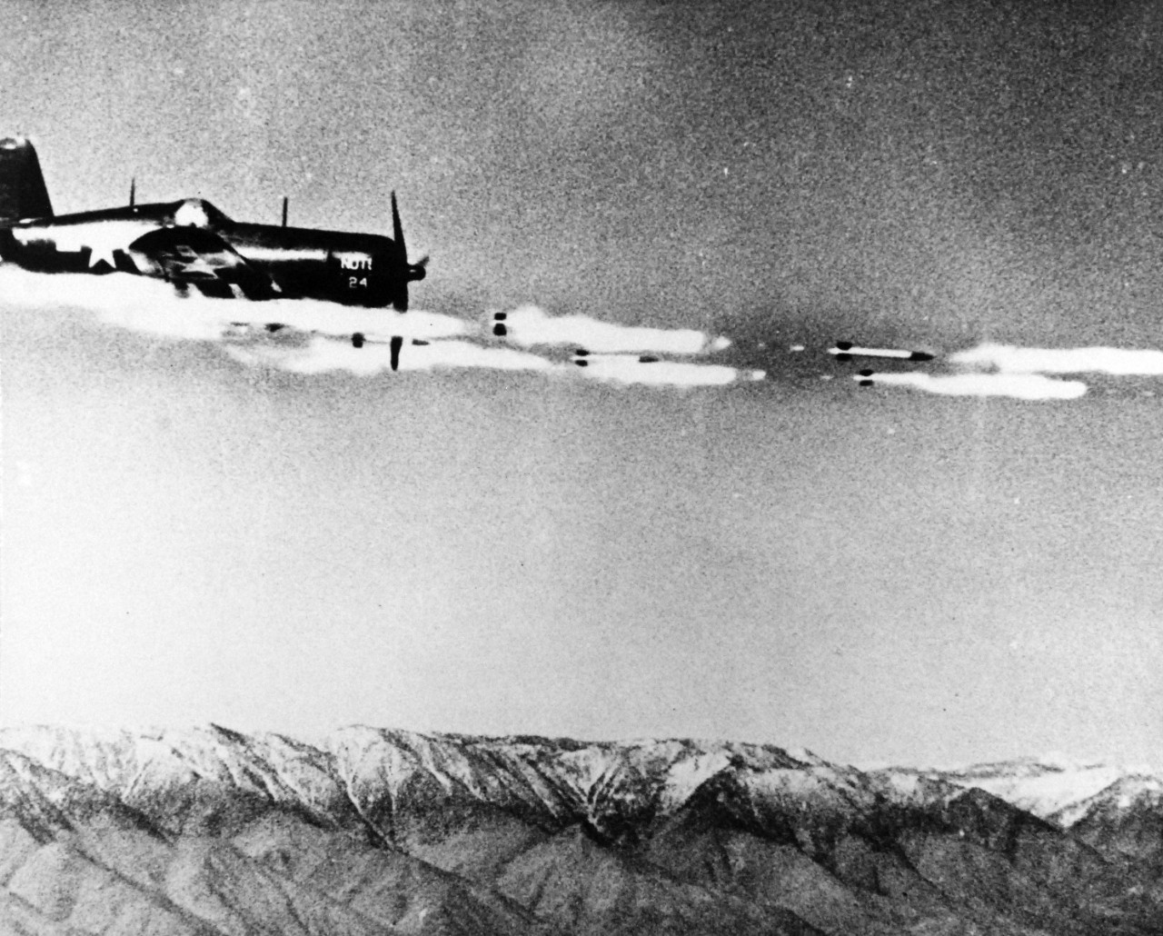 80-G-49320: Vought F4U Corsair, June 1945.   F4U loaded with rockets from Naval Ordnance Test Station, Inyokern, California, June 5, 1945.  Shown:  Rockets being fired from aircraft.    Official U.S. Navy Photograph, now in the collections of the National Archives.  