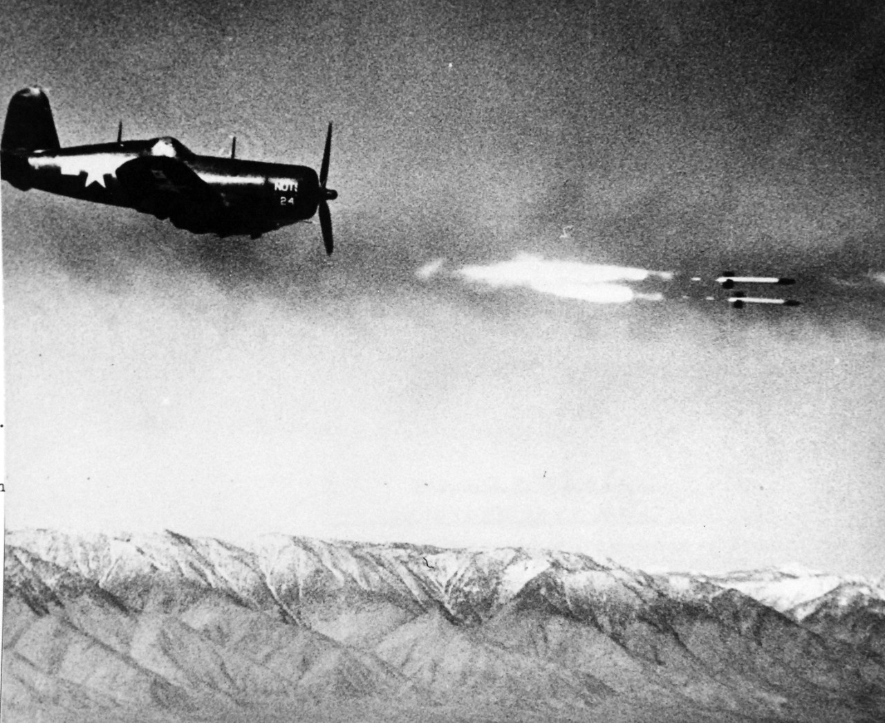 80-G-49321: Vought F4U Corsair, June 1945.   F4U loaded with rockets from Naval Ordnance Test Station, Inyokern, California, June 5, 1945.  Shown:  Rockets being fired from aircraft.    Official U.S. Navy Photograph, now in the collections of the National Archives.  