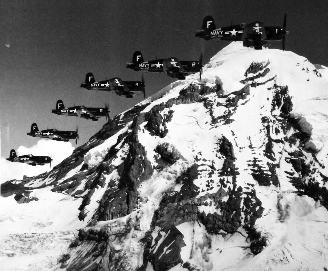 80-G-626682:  Vought F4U-4 Corsairs, July 1953.  Corsairs of (VF 875) flying in formation near Mt. Rainer, Washington.  Photographed July 28, 1953.  U.S. Navy photograph, now in the collections of the National Archives.  