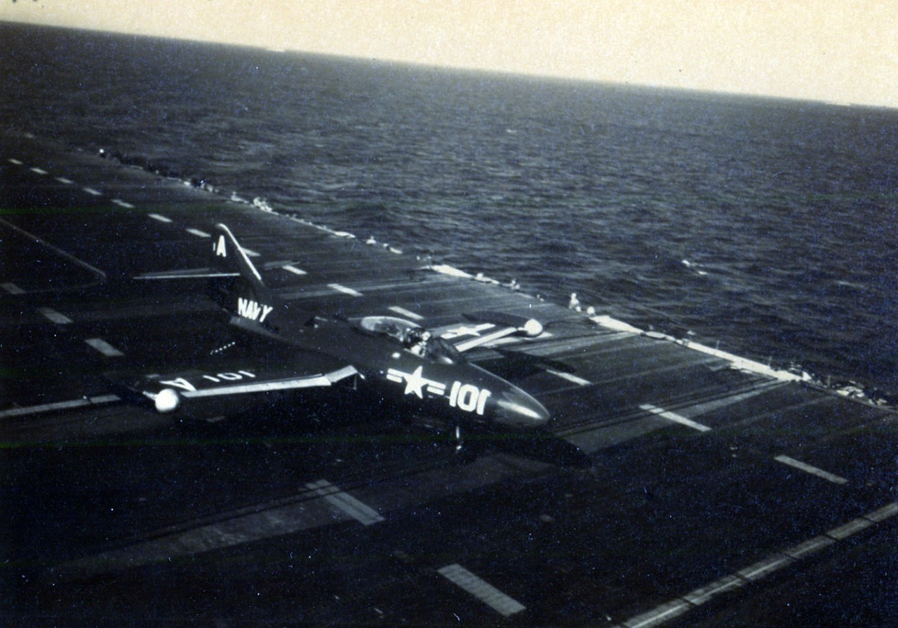 80-G-K 11960:  Grumman F9F Panther, July 1951.  A F9F “Panther” Jet taxis down the flight deck of USS Boxer (CV-21) after landing from a strike on Communist targets in Korea,  1 July 1951.   Photographed by AF1 J.R. Kissinger.   U.S. Navy photograph, now in the collections of the National Archives.