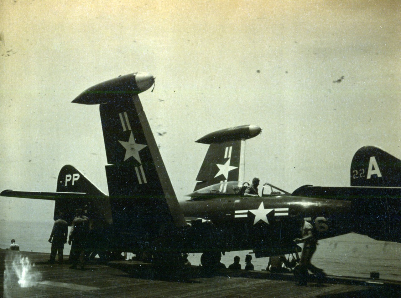 80-G-K 11961:  Grumman F9F Panther, July 1951.  Crewmen service a F9F Panther jet on board USS Boxer (CV-21) off the coast of Korea, 1 July 1951.  Photographed by AF1 J.R. Kissinger.    Official U.S. Navy photograph, now in the collections of the National Archives.   