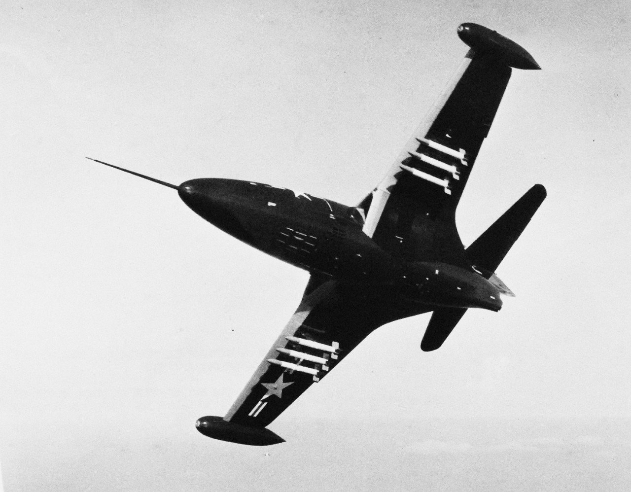 USN 707864:  Grumman F9F Panther, August 1950.  The jet “Panther” (F9F) is shown with only its rocket load of six 6-inch weapons.  In addition, the Panther may also carry two 1,000 pound bombs as well as its four 20mm guns.   Photograph released August 2, 1950.  Official U.S. Navy photograph, now in the collections of the National Archives.  