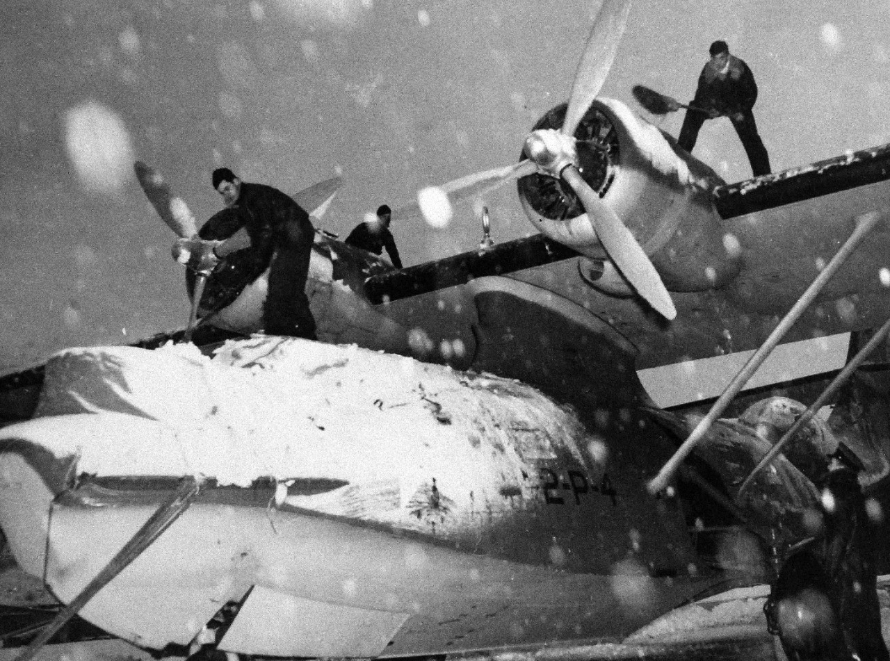80-G-13024:   PBY-5A,  March 1942.   Crew removing snow from wings of the “Catalina” aircraft during a snow-storm at Kodiak, Alaska, March 1942.    Official U.S. Navy Photograph, now in the collection of the National Archives.   (2015/9/29).   