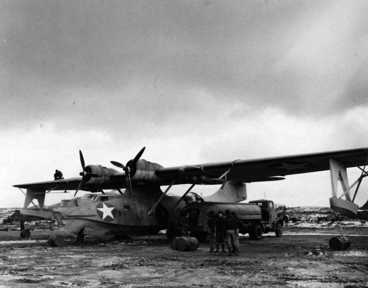 80-G-33168:    PBY-5 “Catalina” patrol bomber, 1942.    Ground crew gassing PBY-5 “Catalina” at Longview, Adak, Alaska, December 12, 1942.  Official U.S. Navy Photograph, now in the collections of the National Archives.  (2016/12/13). 