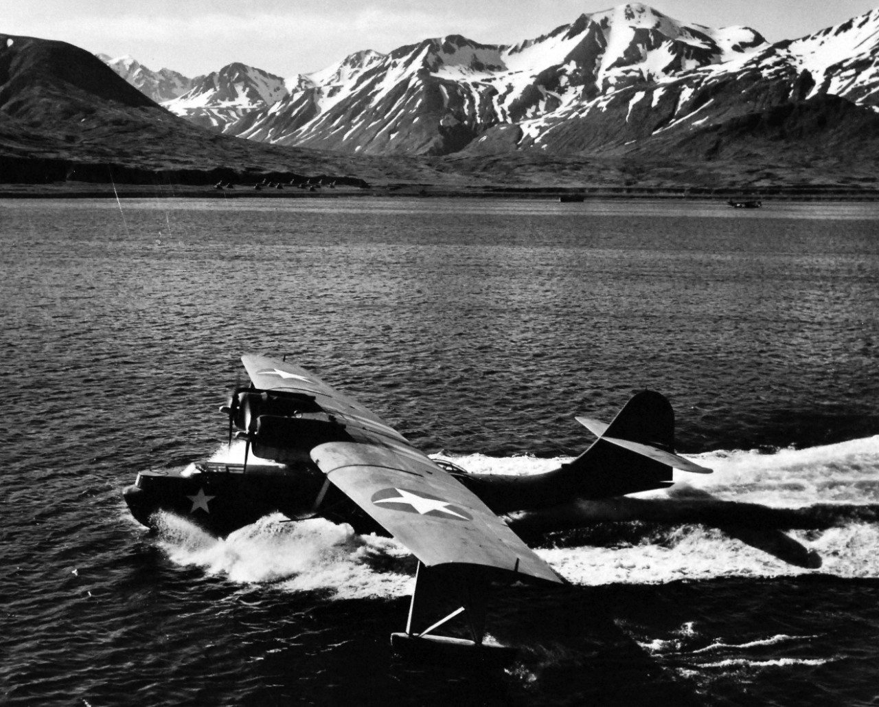 80-G-475723:   PBY-5 “Catalina” patrol bomber, July 1943.   PBY-5 returns from patrol flight to harbor at Attu in Aleutian where its mother ship is anchored. Photographed by Lieutenant Horace Bristol, July 1943.  TR-4213.   U.S. Navy photograph, now in the collections of the National Archives.  (2015/11/17).