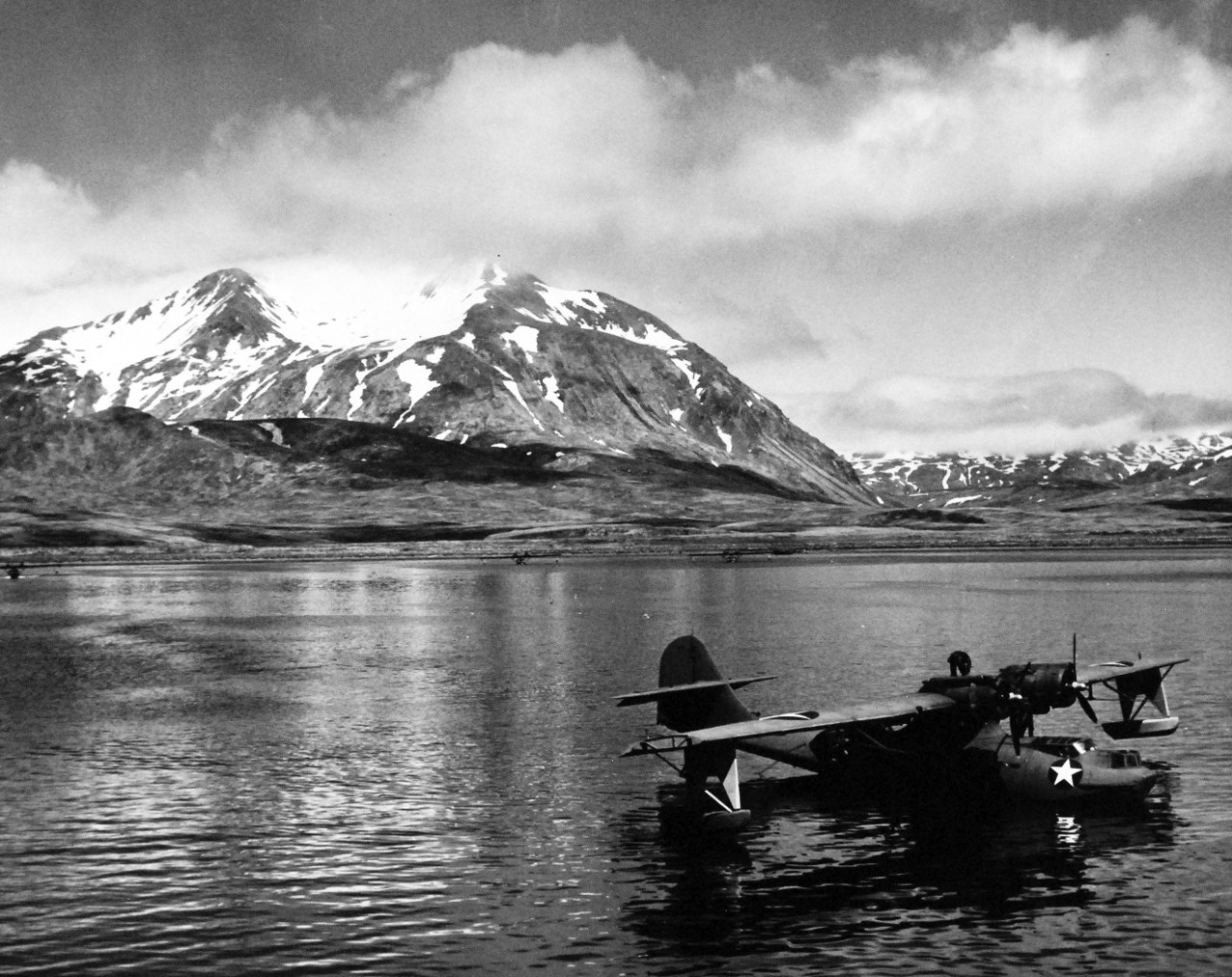 80-G-475732:  PBY-5 “Catalina” patrol bomber, July 1943.   PBY-5 anchored near seaplane tender in Attu Harbor in Aleutians  Photographed by Lieutenant Horace Bristol, July 1943.  TR-5223.  U.S. Navy photograph, now in the collections of the National Archives.  (2015/11/17).