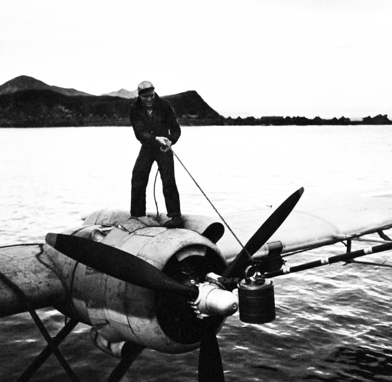 80-G-475768 :  PBY-5 “Catalina” patrol bomber, July 1943.  Can  of oil is hauled aboard a Consolidated PBY “Catalina” aircraft near USS Casco (AVP 12) at Attu, Aleutian Islands.   Photographed by Lieutenant Horace Bristol, July 1943. TR-5367.   U.S. Navy photograph, now in the collections of the National Archives.  (2015/11/17).