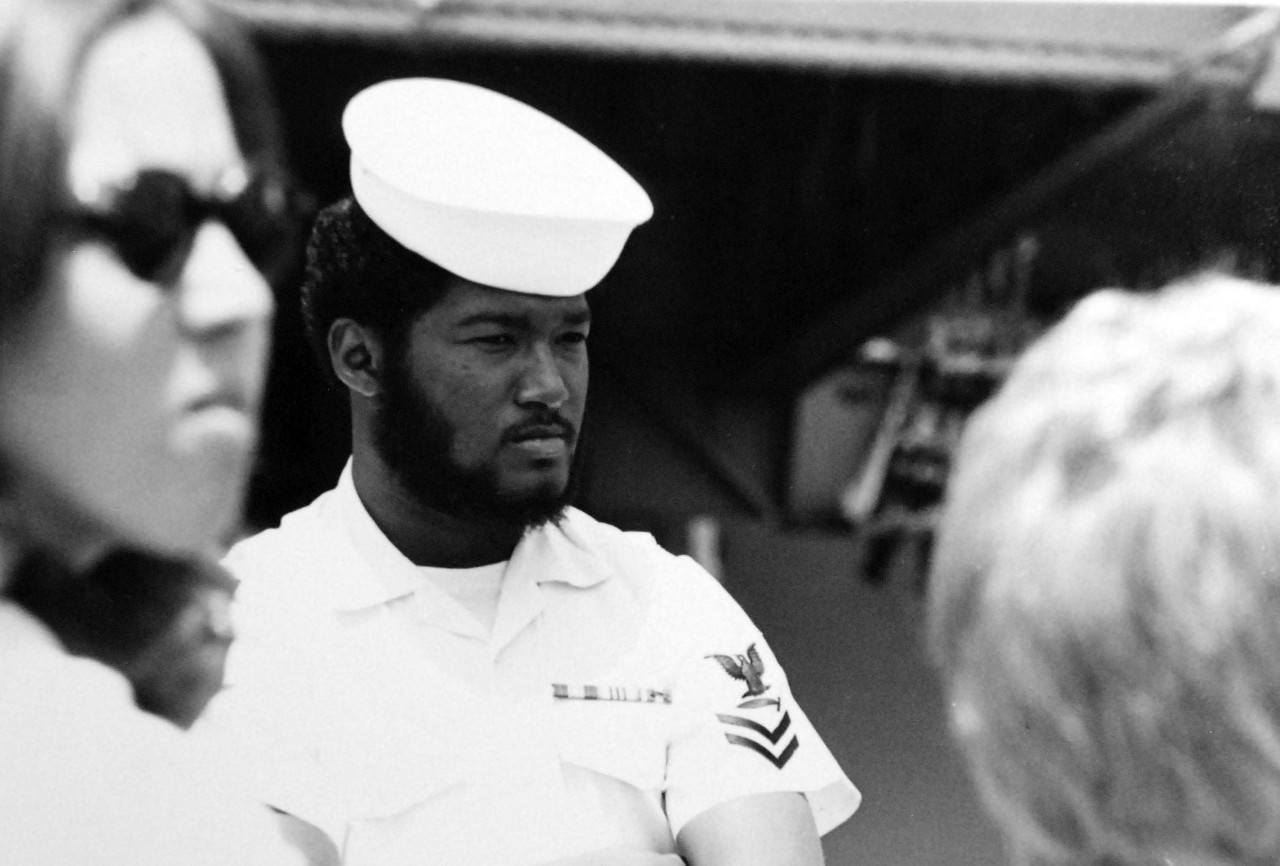 428-GX-USN-1165741:   San Diego, California.   A Petty Officer Second Class is present as USS Ranger (CV-61) enters her new homeport.  Photographed by JO2 Scott Day, July 3, 1975.  Official U.S. Navy Photograph, now in the collections of the National Archives.  