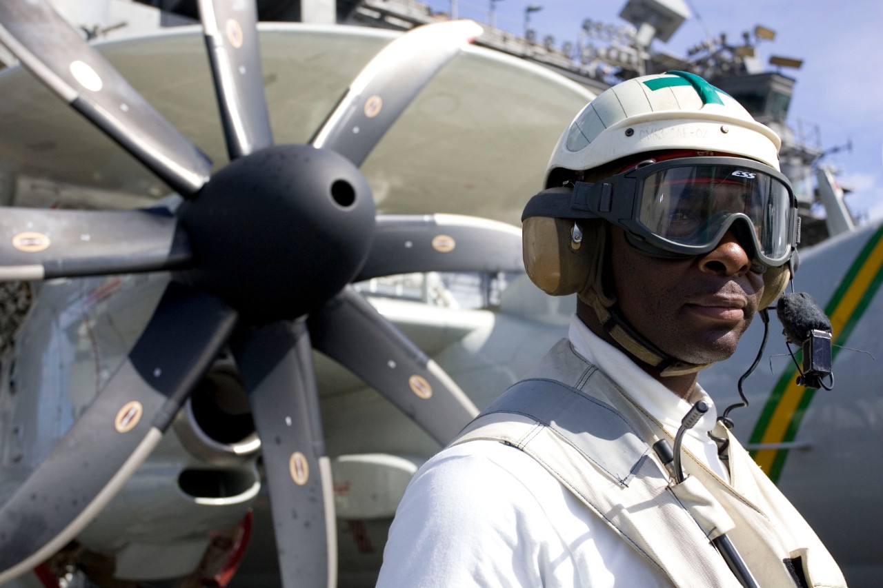 070625-N-8591H-023:  Aviation Ordnanceman 1st Class Adrian Harp, June 2007.   watches flight operations as a safety supervisor on USS Kitty Hawk (CV-63) June 25.  The USS Kitty Hawk Carrier Strike Group is participating in exercise Talisman Saber in the Coral Sea near the coast of Australia.  Kitty Hawk left on its summer deployment May 23 from Fleet Activities Yokosuka, Japan.  Photographed on June 25, 2007 by Mass Communication Specialist 2nd Class Jarod Hodge.  Official U.S. Navy photograph.  