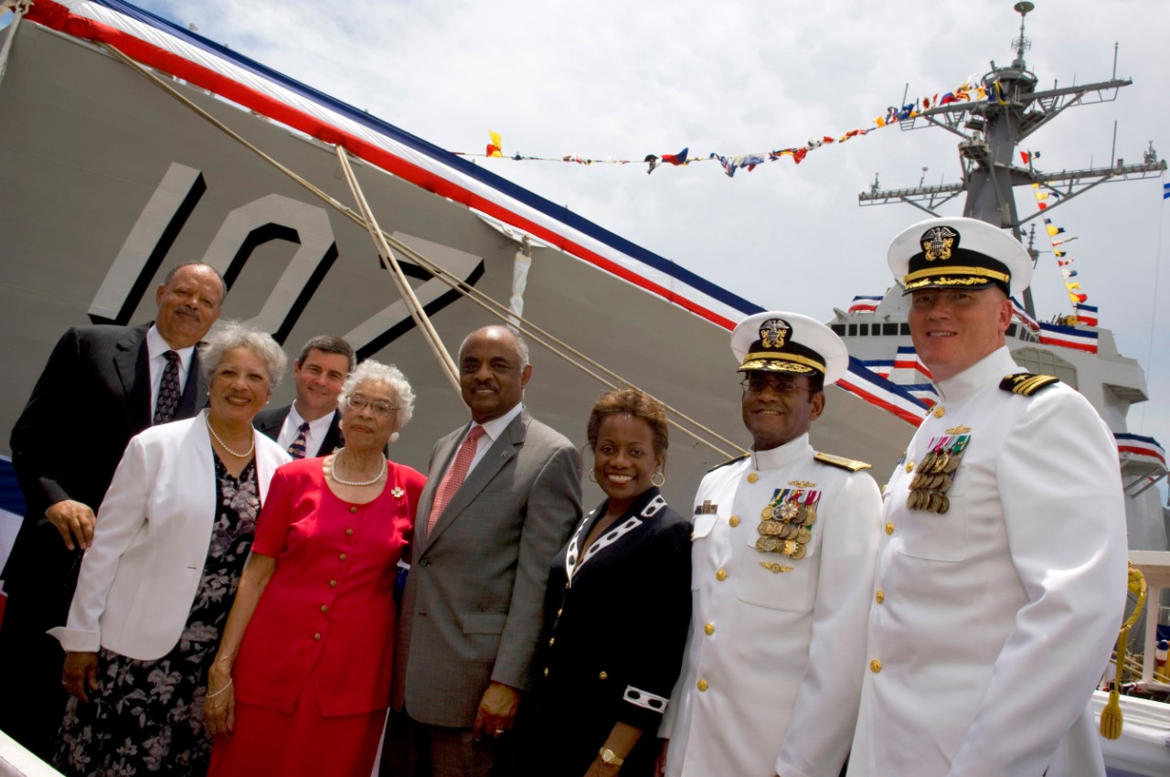 090516-N-5549O-185:   Admiral J. Paul Reason, 2009.   From left to right, (Ret.) Adm. J. Paul Reason, Mrs. Diane Reason, President Northrop Grumman Shipbuilders Mr. Mike Petters, Ship’s sponsor Alma Bernice Clark Gravely, wife of the late Vice Admiral Samuel L. Gravely, Acting Secretary of the Navy BJ Penn, Loretta Penn, Commander U.S. 2nd Fleet Vice Adm. Mel Williams Jr., and the ship’s Commanding Officer Cdr. Douglas Kunzman, pose for a group photo following the christening ceremony of the Arleigh Burke-class destroyer pre-commissioning unit (PCU) Gravely (DDG-107) at Northrop Grumman Shipbuilding, Pascagoula, Miss.  Photographed on May 16, 2009.  The Navy’s newest destroyer is the 57th in her class, and honors Vice Adm. Samuel L. Gravely who was the first African American to command and major warship, achieve flag rank, and command a numbered fleet.  Photo by Mass Communication Specialist 2nd Class Kevin S. O’Brien.   Official U.S. Navy Photograph, now in the collections of the National Archives. 
