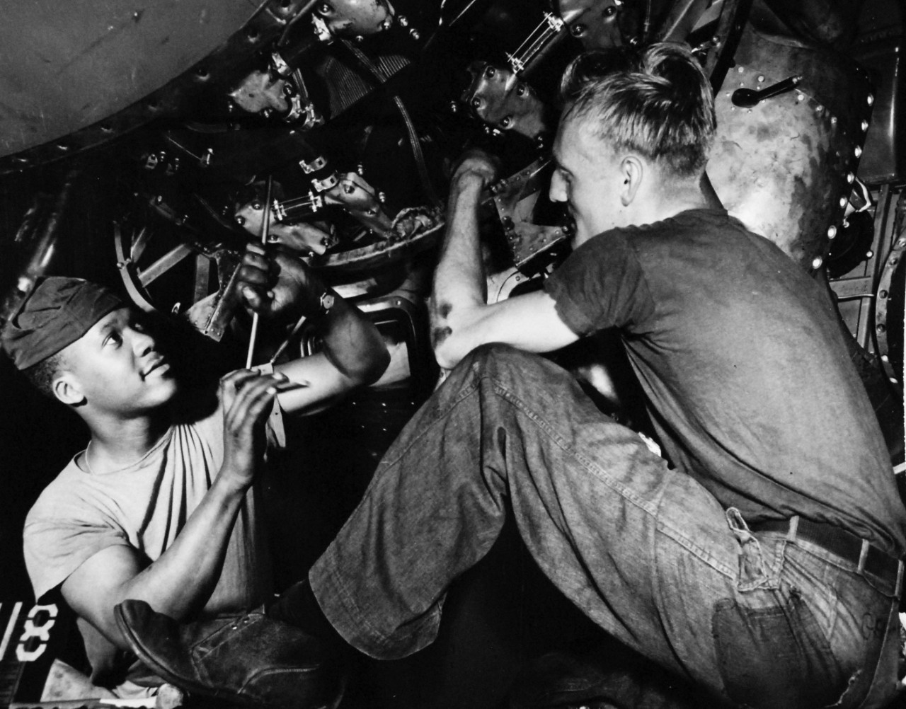 80-G-413544:   USS Coral Sea (CVA 43), April 11, 1949.    AD3 T.W. White, (left), and AD1 Gerhard working on an aircraft.   Official U.S. Navy Photograph, now in the collections of the National Archives.  