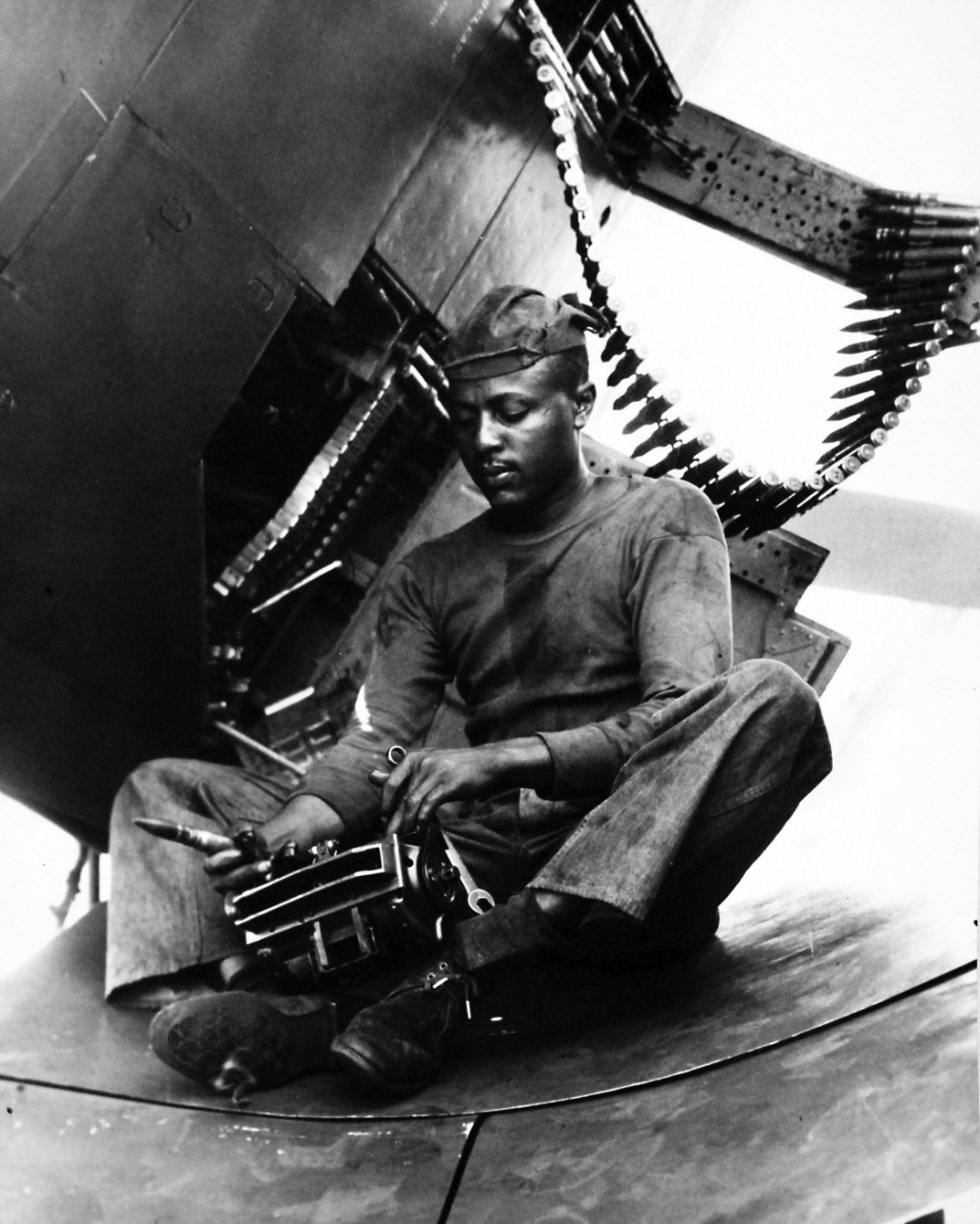 80-G-431465:  Aviation Ordanceman Airman Joseph L. Jones, July 1951.   USS Midway (CVB-41) at sea. Jones is arming an F4U-5.   Photographed by PH3/C J.L. Goss, July 6, 1951.  U.S. Navy Photograph, now in the collections of the National Archives.  