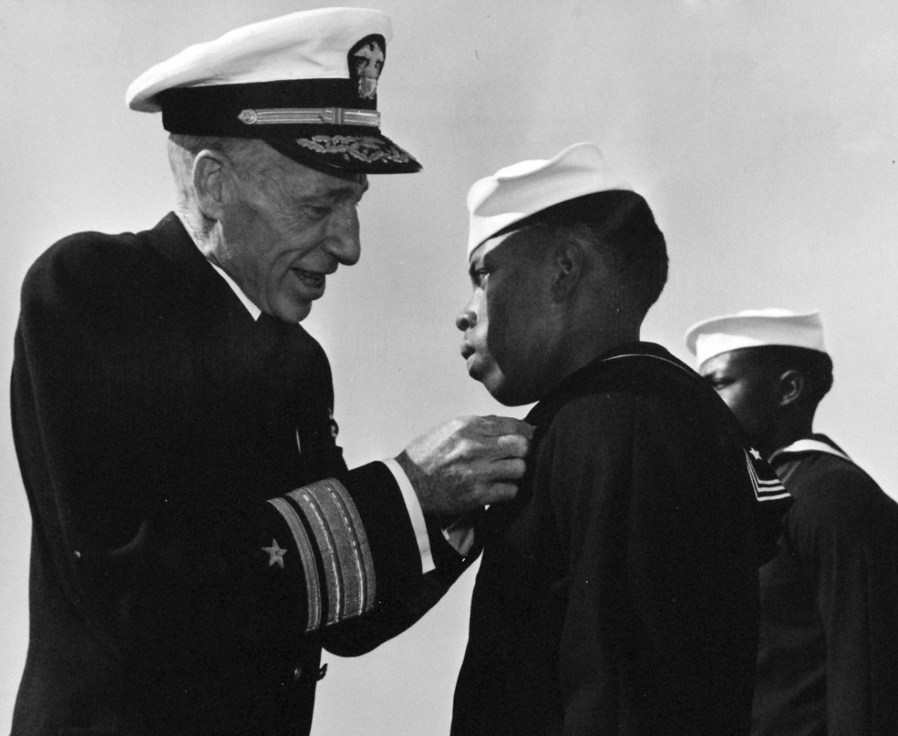 80-G-47284:  Seaman Second Class Effus S. Allen, USNR, 1944.  Rear Admiral Carleton H. Wright presenting the Navy and Marine Corps Medal to Seaman Second Class Effus S. Allen, USNR.   Received the medal for risking his life to bring flames under control during the Port Chicago Magazine, California, explosion and fire.    Photograph filed December 9, 1944. Official U.S. Navy photograph, now in the collections of the National Archives.   
