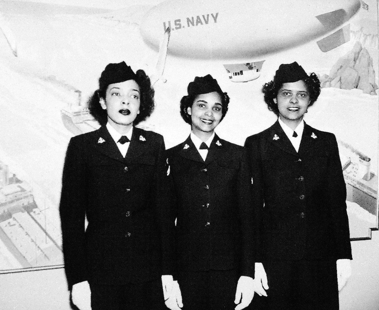 208-NP-126506:   First African American WAVES enter Hospital School at Medical Center, Bethesda, Maryland, 1945.   Hospital Apprentices Second Class Ruth C. Issacs; Katherine Horton; and Ines Patterson, left to right, are the first African-American WAVES to enter the Hospital Corps School at the National Naval Medical Center, Bethesda, Maryland, March 2, 1945.  Official U.S. Navy photograph, now in the collections of the National Archives.
