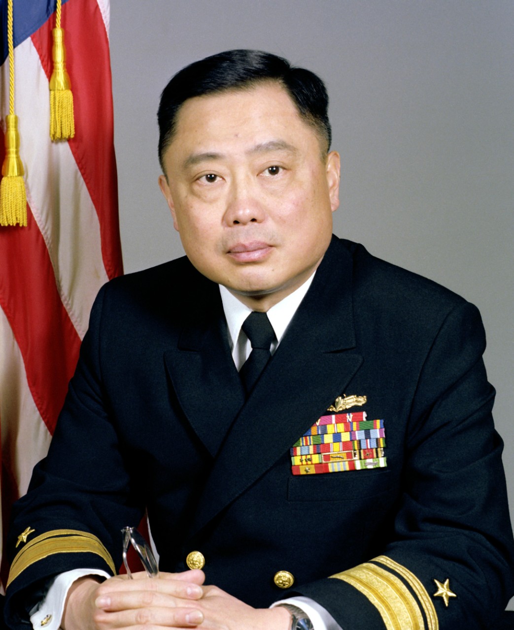 330-CFD-DN-SC-83-03635:  Rear Admiral Ming Chang, 1983.  Rear Admiral Chang is believed to be the first foreign-born, naturalized American to command a U.S. warship. In 1980, he was the first naturalized Asian-American to be promoted to flag rank. Chang served for thirty-four years in the U.S. Navy before retiring in his post as Inspector General of the Navy during his last tour in the early 1990s. Photographed by PH2 Dunigan.   Official U.S. Navy photograph, now in the collections of the National Archives.   