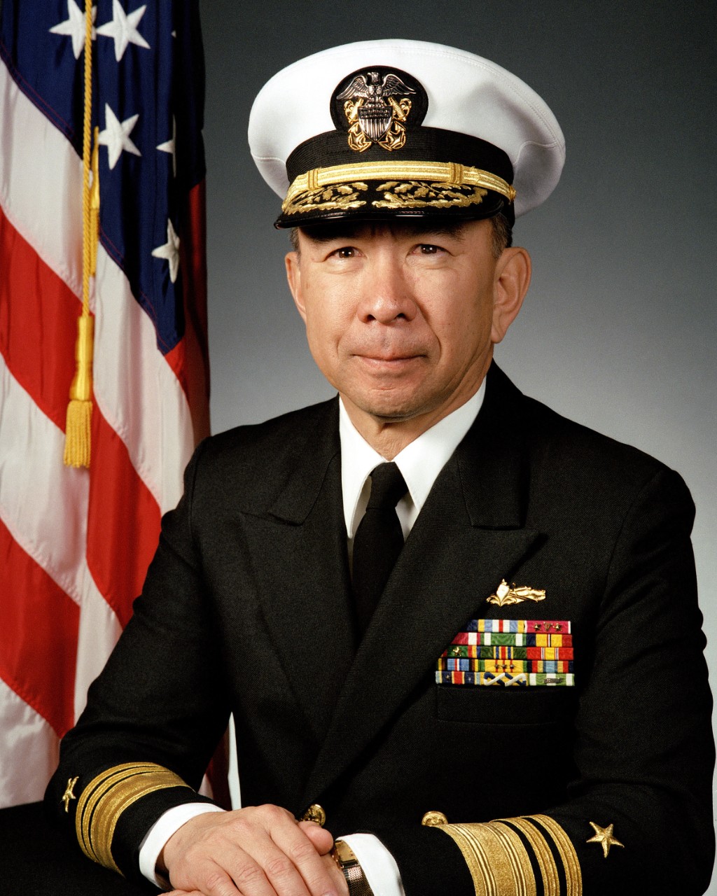 330-CFD-DN-SC-91-11727:   Vice Admiral Robert K. U. Kihune, USN, 1991. Portrait photograph with cover.   Photographed by Richard L. Oasen, April 4, 1991.  Official U.S. Navy photograph, now in the collections of the National Archives 