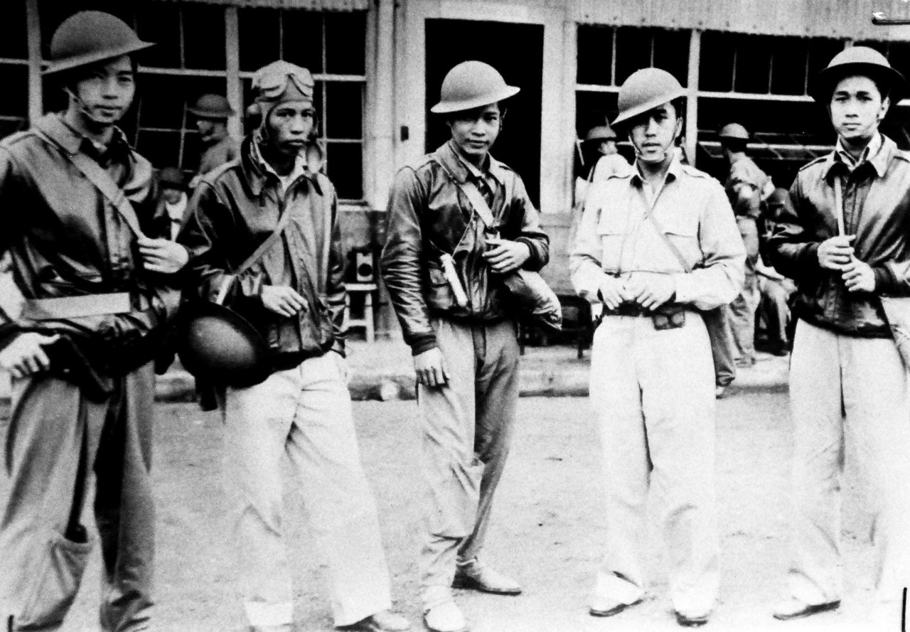 LC-Lot 9431-16:  Determined To Fight To the End, December 1941.     These are some of the Filipino pilots pictured in the Philippines, who raised havoc in the ranks of the Japanese when the invades moved on from the Philippine Islands. Second to right is Captain Jesus A. Villamor, first Filipino to receive the Distinguished Service Cross for heroism.  The Distinguished Service Cross is the U.S. Army’s version of the Navy Cross.  Villamor received the award for his actions in December 1941.  The Philippines would fall in the spring of 1942 to the Japanese, and U.S. would not return until  October 1944.  The U.S. Navy would play a vital part in returning the Philippines back to the Allies. Office of War Information photograph.  Courtesy of the Library of Congress.  