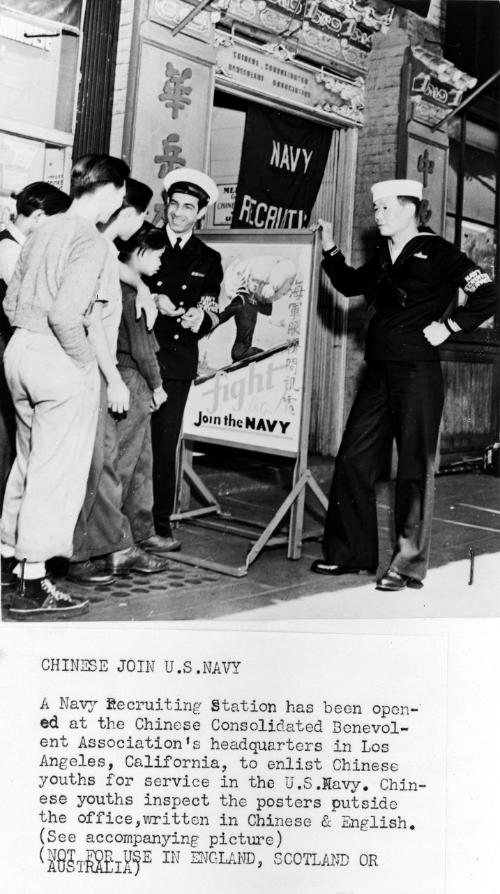 LC-USZ62-103075:   “Chinese Join U.S. Navy”, circa WWII.   Chinese youths inspecting posters in English and Chinese, displayed by Oriental and American naval personnel in Los Angeles.  Office of War Information Photograph.  Courtesy of the Library of Congress.   