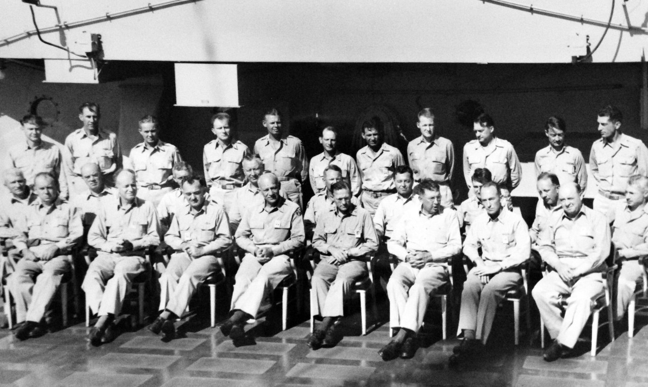 LC-Lot 11532-1:  Operation Sandstone, November 1947-June 1948. This operation was the third nuclear test in the region.  Front row (left to right):  Major General John Barker, USAF; Rear Admiral W.S. Parsons, USN; Major General William A. Kepner, USAF; Lieutenant General John E. Hull, USA; Dr. Darrol K. Froman, University of California; Rear Admiral F.C. Dennebrink, USN; Captain James S. Russell, USN; Rear Admiral A. J. Wellings, USN.  Center Row, (left to right):  Captain H.H. Haight, USN; Colonel James F. Cooney, USA; Colonel Thomas J. Sands, USA; Brigadier General Claude B. Ferenbaugh, USA; Brigadier General David A.O. Ogden, USA; Captain Charles H. Anderson, USN; Lieutenant Colonel Peter Schmick; Commander Christian L. Engleman, USN; and Colonel Benjamin L. Engleman, USAF.  Back row, (left to right):  Commander Frank I. Winand, USN; Brigadier General F.T. Cullen, USAF; Colonel Joseph A Morris, USAF; Lieutenant Colonel James H. Brown, USA; Lieutenant Colonel Garlen R. Bryant, USA; Commander Horacio Rivero, Jr., USN; Lieutenant Commander Phillip R. Cibotti, USA; Commander Robert M. Whittemore, USN; Major J.D. Willoughby, USA; Captain C.H. Duerfeldt, USN; and Lieutenant Commander J.K. Wollnough, USA.   Photographs show preparation for the atomic bomb tests at Eniwetok Atoll (Marshall Islands), the actual blasts and the visible effects. Military construction, photography, meteorology, radiology, and communications; aircraft; daily life; Navy, Air Force, and civilian staff portraits; first successful color photograph made by atomic bomb flash, showing Navy spectators.  U.S. Air Force Joint Task Force Seven. Images photographed through Mylar sleeves.  Courtesy of the Library of Congress.  