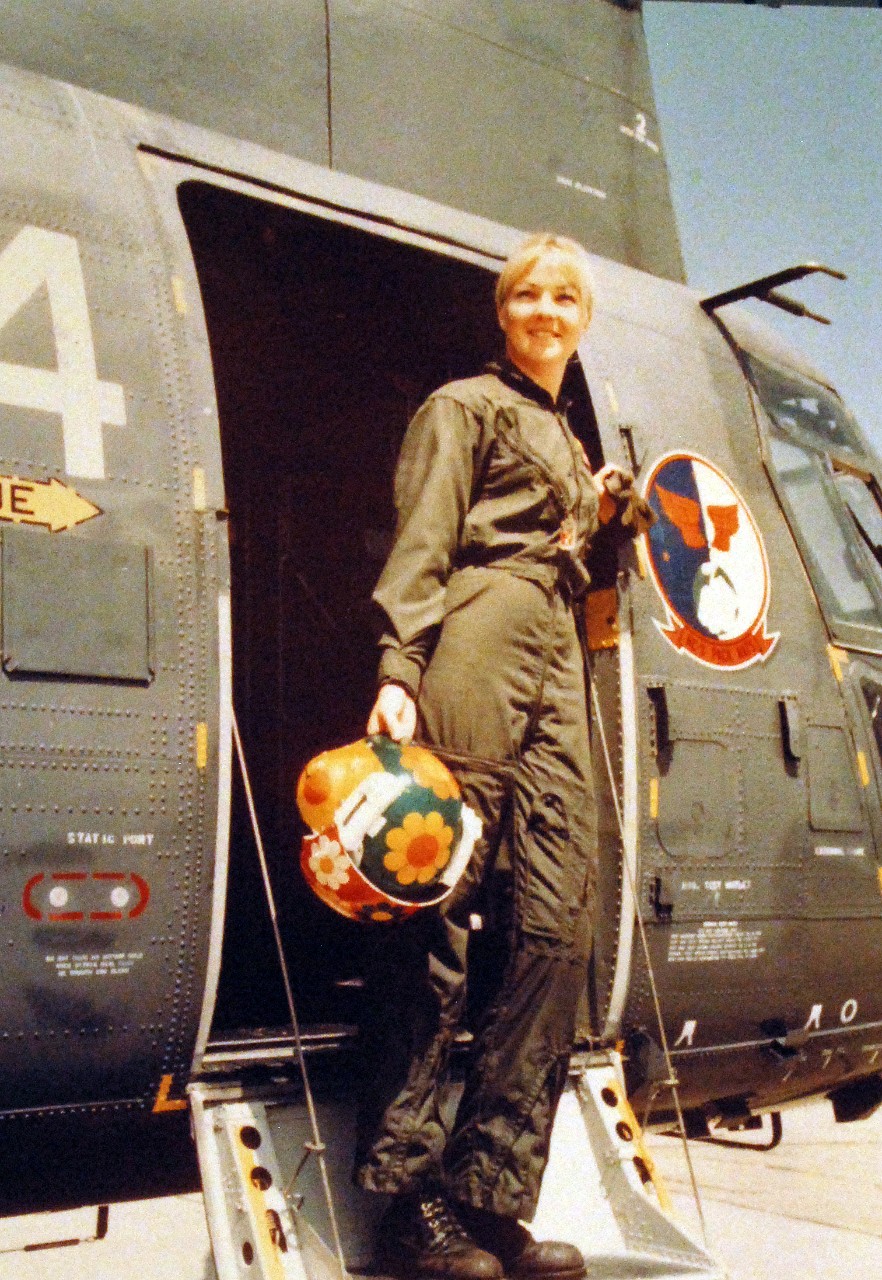 428-GX-K-108402:  Ensign Joellen Brag, May 1975.   She is the Navy’s first woman helicopter co-pilot, with one of the CH-46 “Sea Knight” helicopters of her squadron, Helicopter Support Squadron Three, HC-3.  Photographed by JO3 Susan Fisher, at Naval Station North Island, California, May 9, 1975.     U.S. Navy Photograph, now in the collections of the National Archives.  