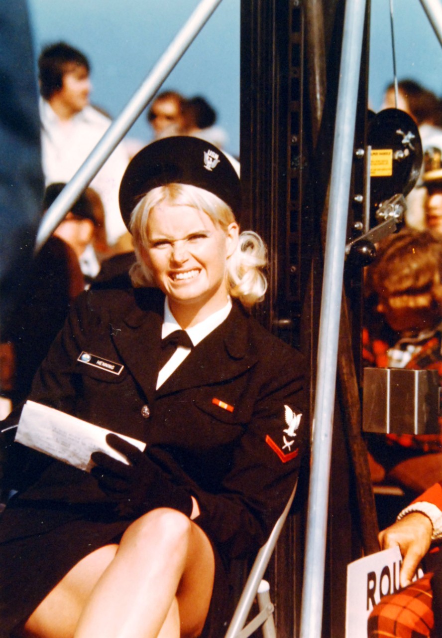 428-GX-K-116625:   Yeoman Third Class Henning, January 1977.    Henning is present to watch the U.S. Championship Boxing Quarterfinals on the training aircraft carrier, USS Lexington (CVT-16) while at Naval Air Station, Pensacola, Florida.  .  Photographed by Ken Regan, January 16, 1977.    Official U.S. Navy Photograph, now in the collections of the National Archives.   