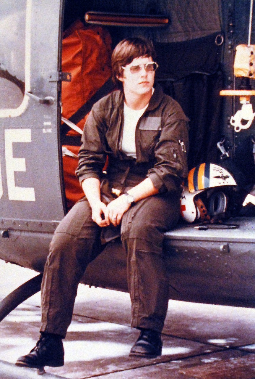 428-GX-K-118315:  Hospital Corpsman Third Class Dianna Heath, October 1977.   Heath waits for a fuel truck, so she can refuel a UH-1N Iroquois Helicopter.  She is first female UH-1N “Iroquois” crewman on Guam.   Photographed by JOC John D. Burlage, received October 1977.     Official U.S. Navy Photograph, now in the collections of the National Archives.  