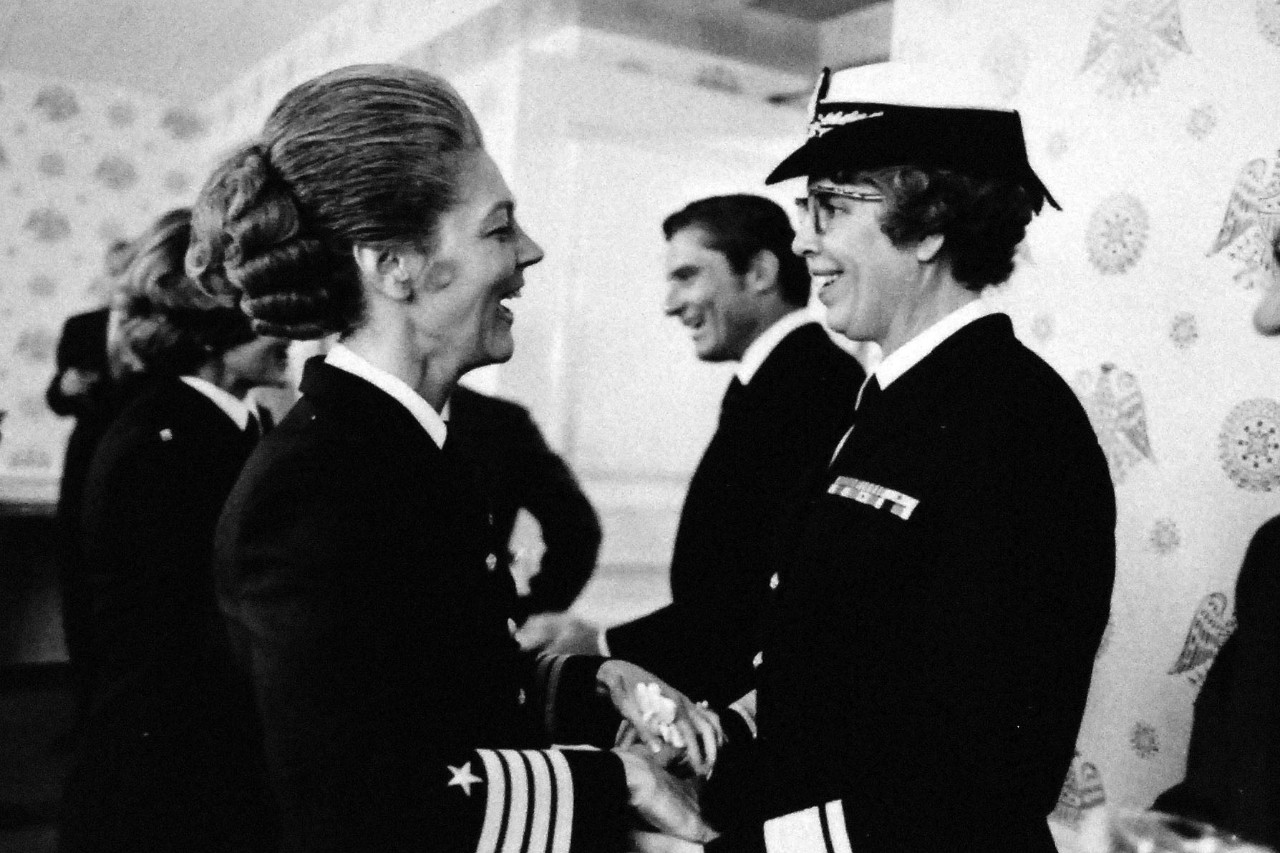 428-GX-USN 1151703:   Rear Admiral Arlene B. Duerk, June 1972.  Captain Robin L. Quigley, (left), Assistant Chief of Naval Personnel for Women, congratulates Rear Arlene B. Duerk, Director of the Navy Nurse Corps, during a reception following her promotion ceremony in the office of the Secretary of the Navy, Washington, D.C.     Photographed by PH1 Billy L. Mason, June 1, 1972.    Official U.S. Navy Photograph, now in the collections of the National Archives. Photographed from small reference card.   