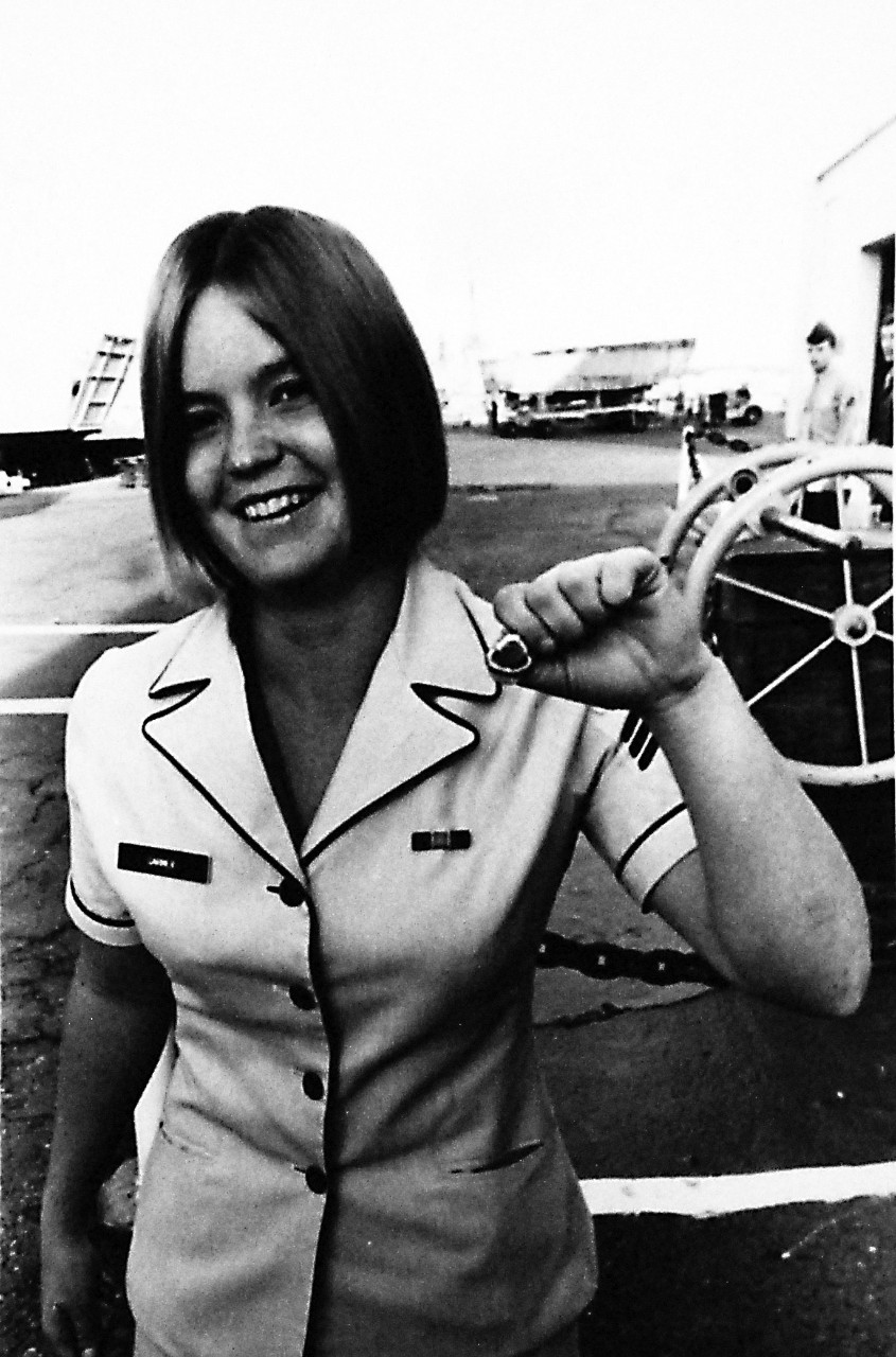 428-GX-USN 1158119:   Personnelman Seaman Nancy K. Garner, March 1974.  She proudly displays her scuba diving insignia at Naval Station San Diego, California.   Garner is the first Navy woman to graduate from the Navy Diving School.  Photographed November 1973.   Official U.S. Navy Photograph, now in the collections of the National Archives.  