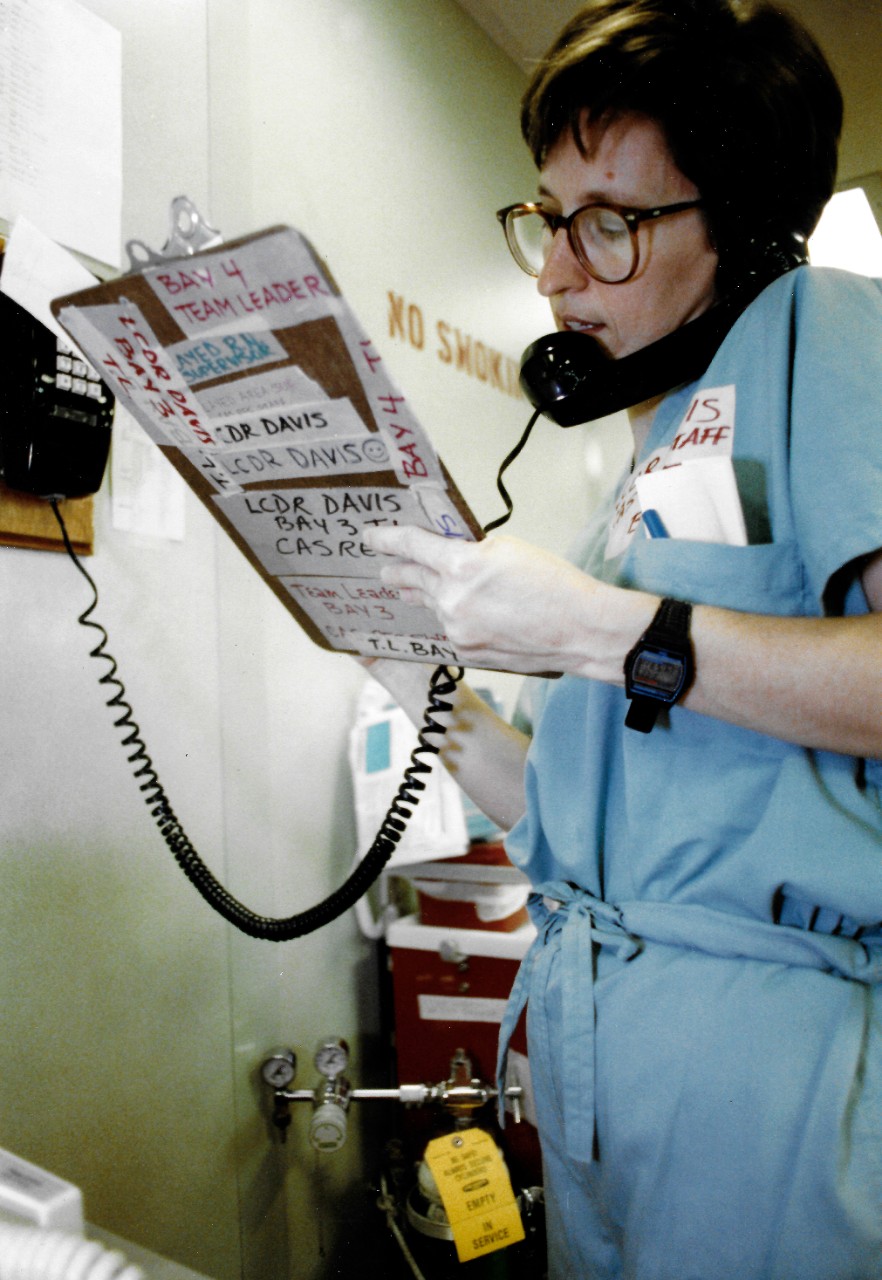 330-CFD-DN-SC-91-07601:   Navy Nurse, January-March 1991.  A nurse records information on a chart aboard USNS Comfort (T-AH-20).  The vessel is deployed to the Persian Gulf during Operation Desert Storm.  Photographed by JO1 Joe Gawlowicz.   Official U.S. Navy Photograph, now in the collections of the National Archives.