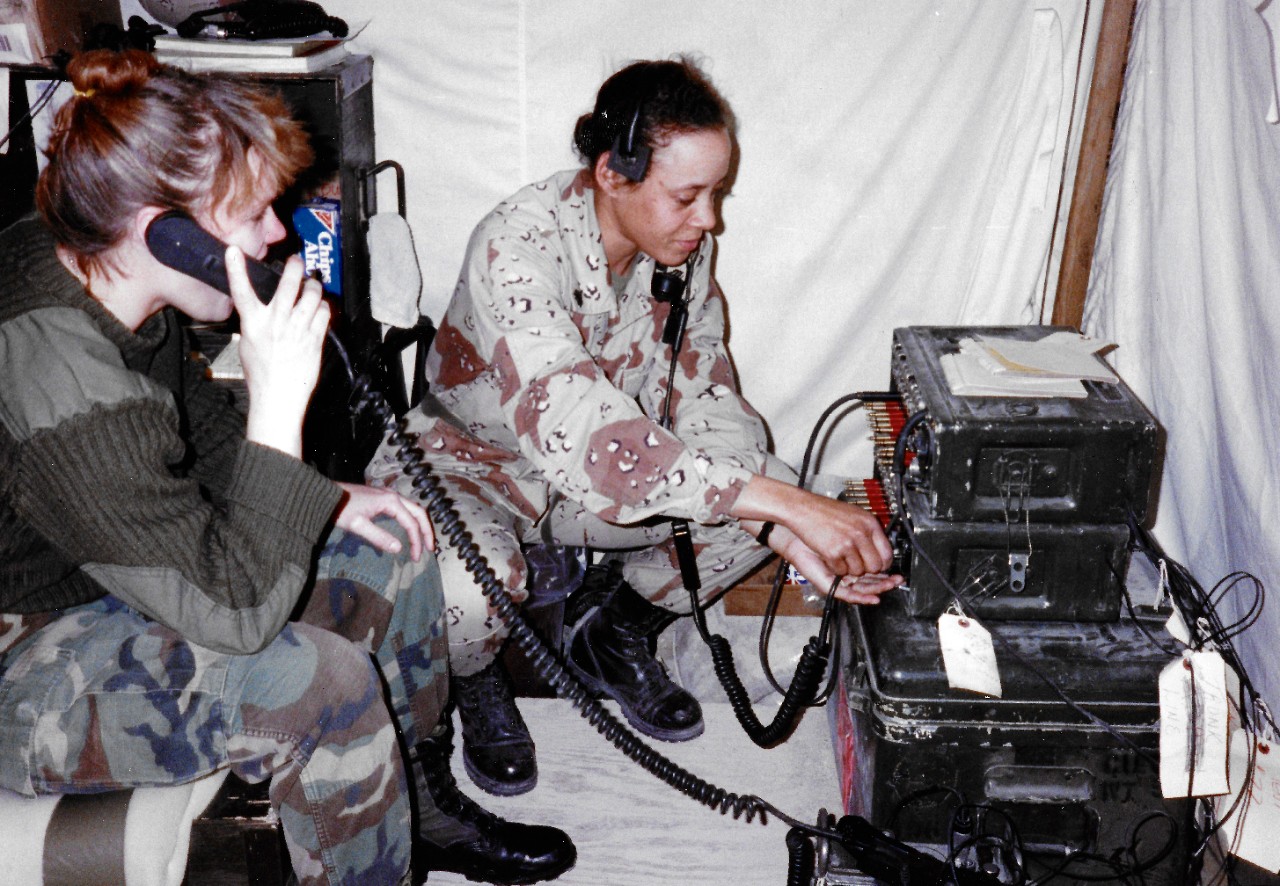 330-CFD-DN-SC-91-11515:   Female Hospital Corpsman, February 1991.   The Corpsmen set up a communication station at field hospital in Saudi Arabia during Operation Desert Storm.  Photographed by CWO2 Edward Baily, February 7, 1991.    Official U.S. Navy Photograph, now in the collections of the National Archives.