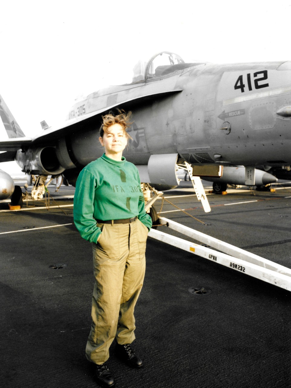 330-CFD-DN-SC-93-05709:   Aviation Structural Mechanic First Class Castilleja, 1992.   Castilleja, a reservist attached to Strike Fighter Squadron 305 (VFA-305), stands beside an F/A-18A Hornet aircraft on the flight desk of USS Nimitz (CVN-68).  Photographed by PH2 Tim Tow, August 12, 1992.   Official U.S. Navy Photograph, now in the collections of the National Archives.